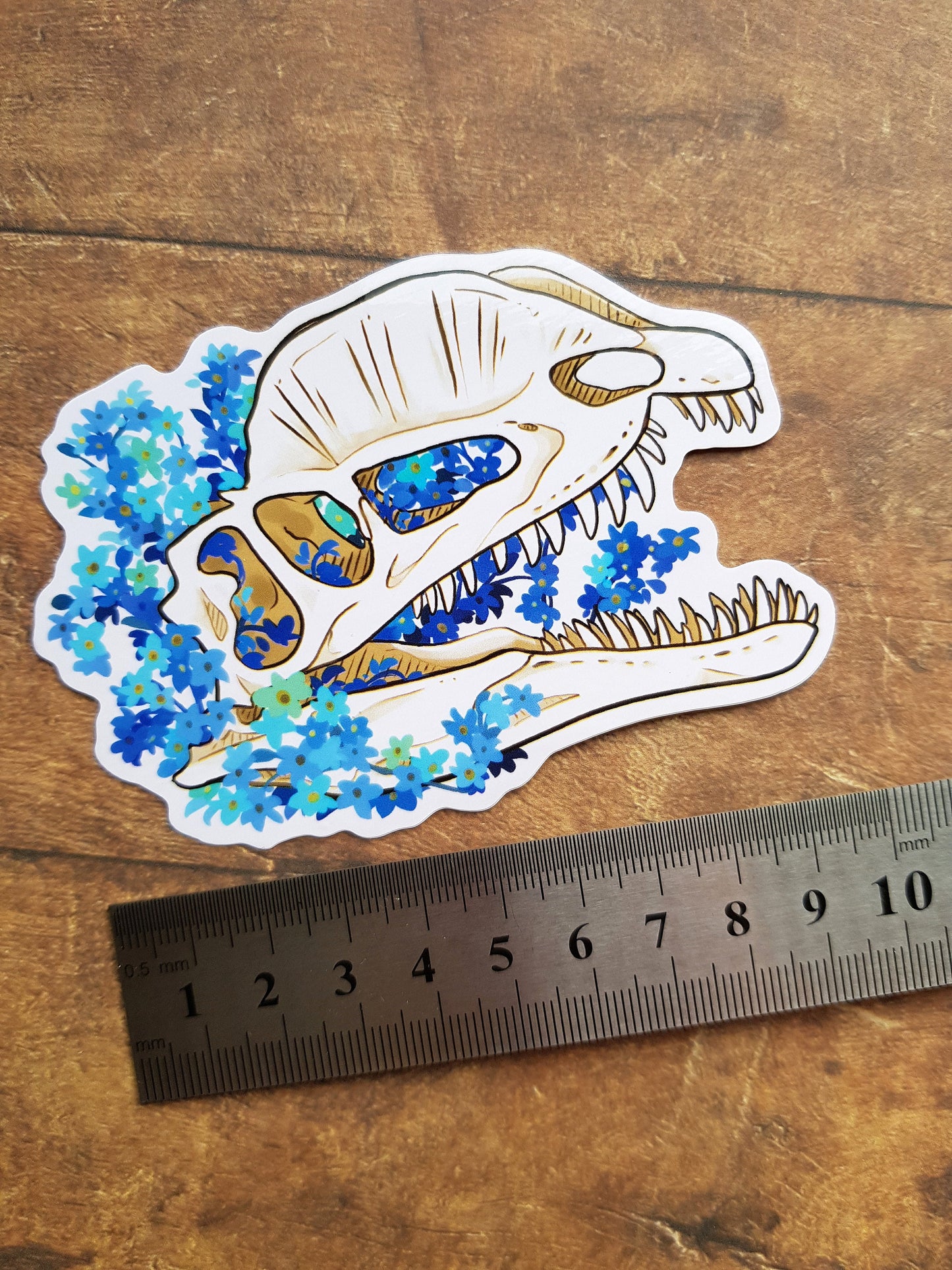 Dilophosaurus Forget Me Not - White Vinyl Sticker